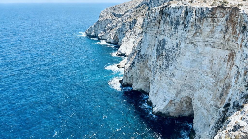 Serene Echoes of the Aegean: Where Azure Waves Embrace Ancient Cliffs